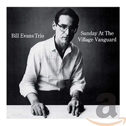 Black and white album cover featuring pianist Bill Evans in glasses.