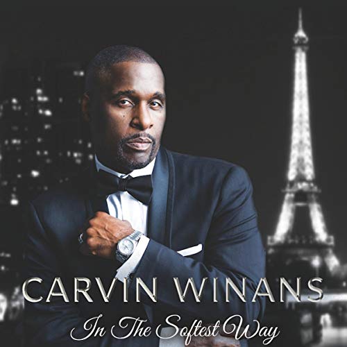Man in tuxedo with Eiffel Tower in background, album cover art for "In The Softest Way".