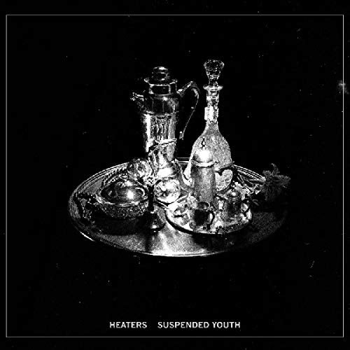Black and white image of a tray with various glassware and a hookah on it.
