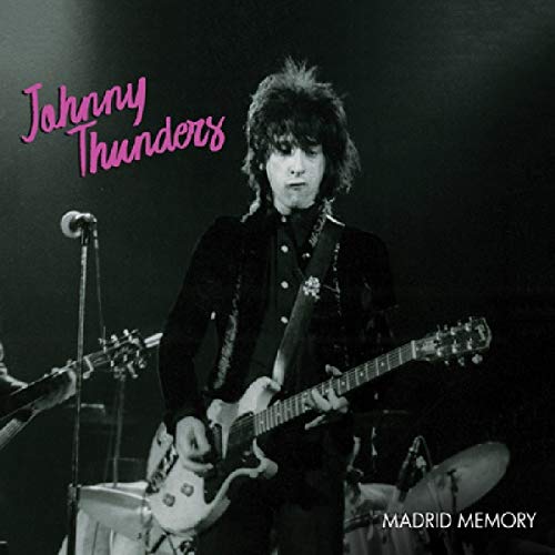 "Vinyl album cover featuring Johnny Thunders playing guitar on stage in black and white."