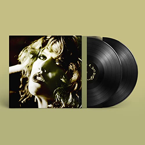Vinyl record album cover showing a woman's face next to two black vinyl discs.