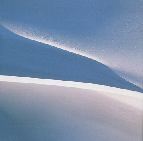 CD cover with abstract blue and white wavy landscape design.