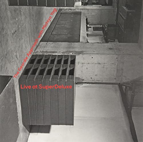 Vinyl record cover: geometric shapes and red text reading "Live at SuperDeluxe".