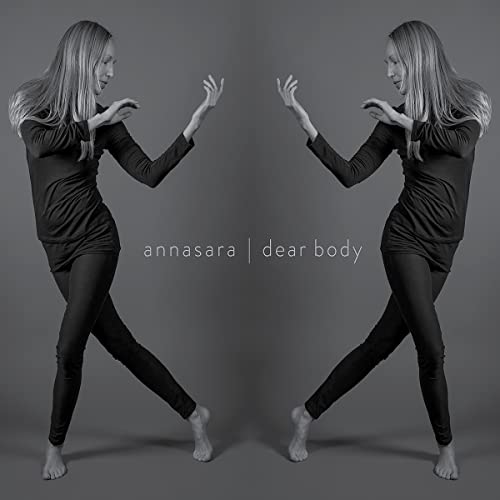 Black and white album cover featuring a woman in dance pose, mirrored.