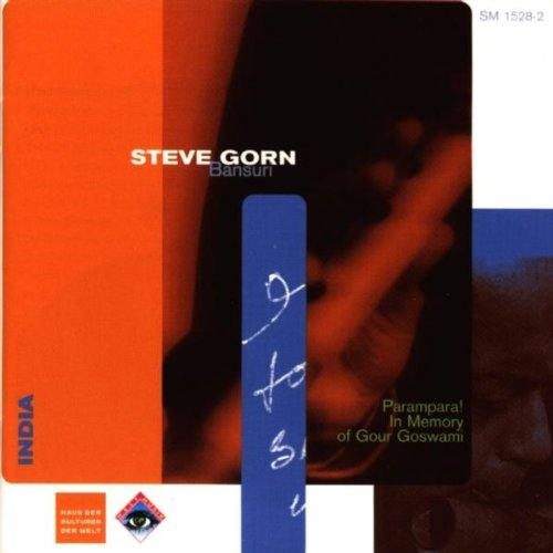 "Album cover with orange, blue, and white design, featuring a dark image."
