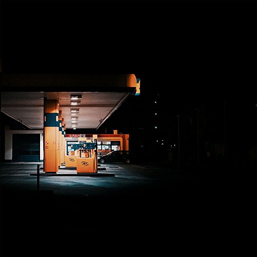 The image depicts a CD with a gas station scene on its cover.