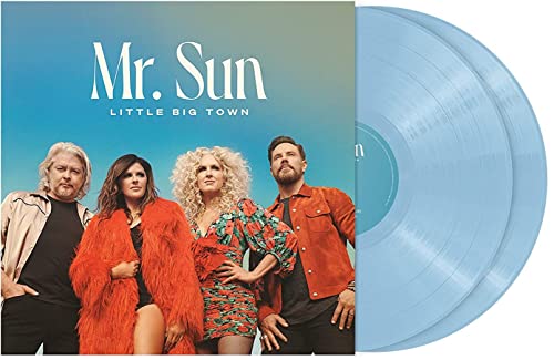 Four musicians on album cover next to blue vinyl records on white background.