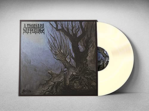 Vinyl record with dark tree illustration on the album cover.