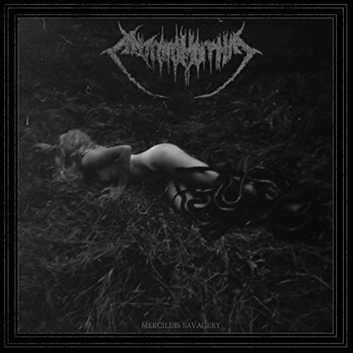 Black and white vinyl album cover with a nude woman lying in dark grass.