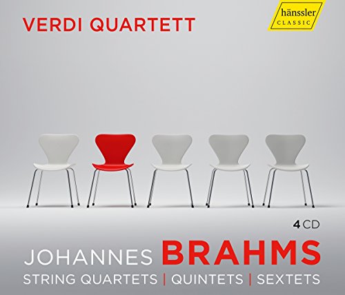 Album cover featuring five chairs, one red, against a gray background.