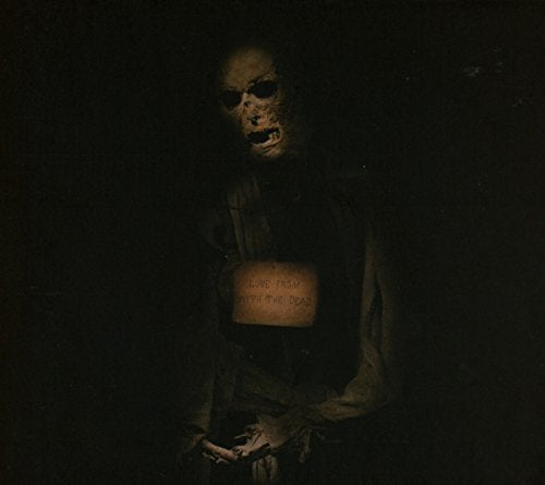 Dark image of a ghostly figure holding a sign reading "Love From With The Dead.