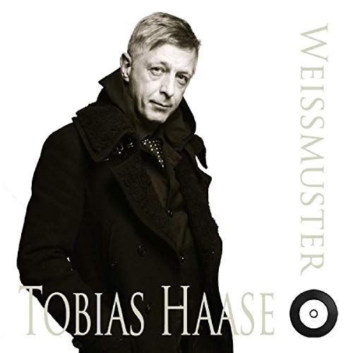 Tobias Haase in a dark coat, with vinyl icon and text on a white background.