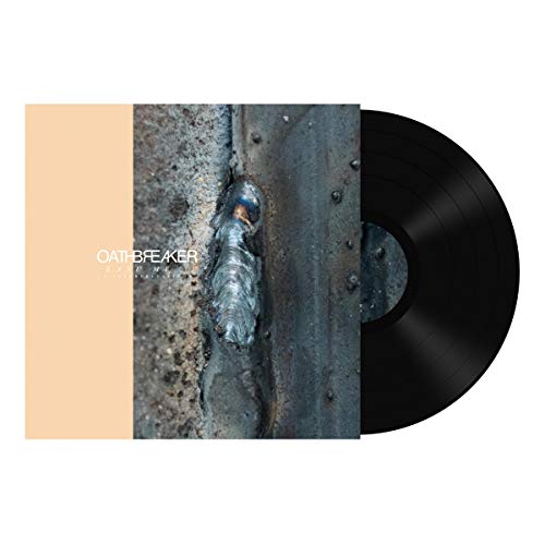 Vinyl record with a cover featuring a metal plate and rivets.