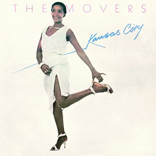 Woman in white dress and heels poses on vinyl album cover with "The Movers" text.