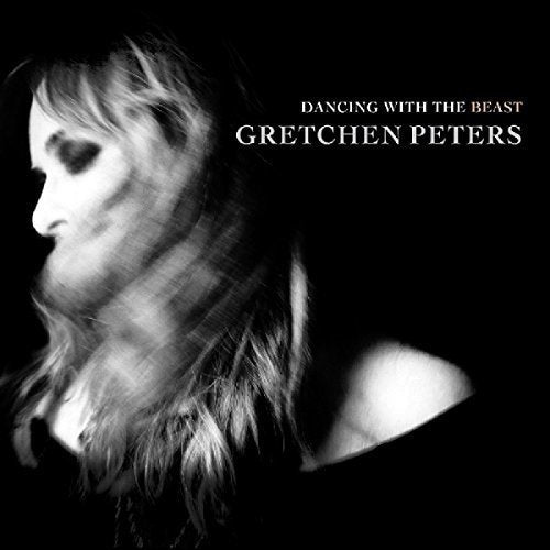 "Black and white album cover featuring a blurred profile of a woman."