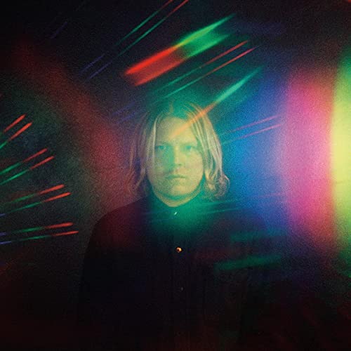 Ty Segall album cover: portrait with colorful, blurred light streaks.