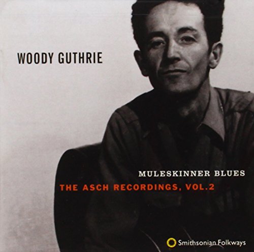 Black and white photo of Woody Guthrie on a CD cover.