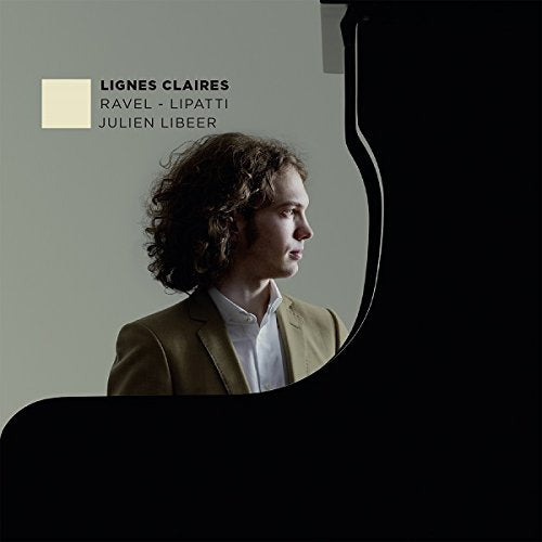 CD cover with a man standing beside a grand piano, grey background.