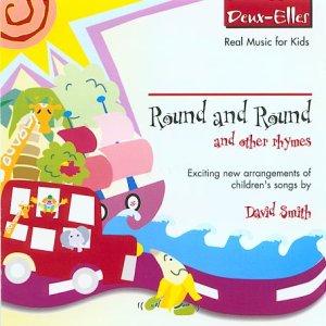 "Children's music CD cover featuring cartoon bus and child, colorful design, and title 'Round and Round'."