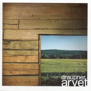 A CD cover featuring a wooden wall with a view of a green field.