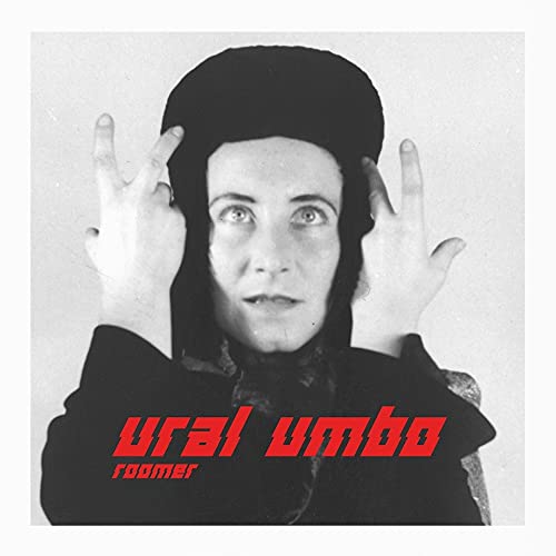 "Black and white album cover with a person and red text."