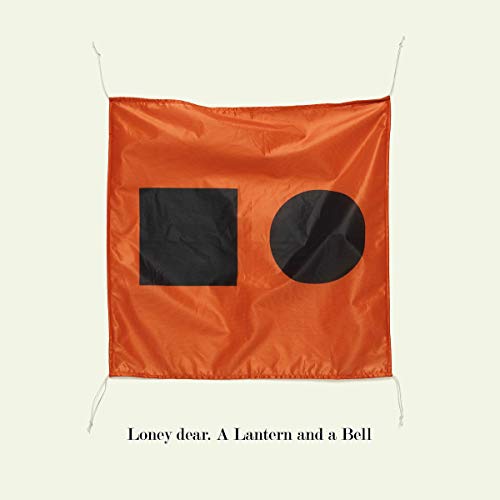 Orange fabric with black square and circle, album cover for Loney Dear.