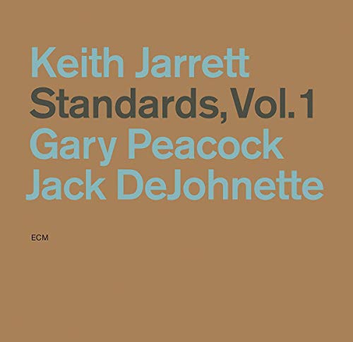Brown album cover with light blue and dark gray text, displaying artist and title information.