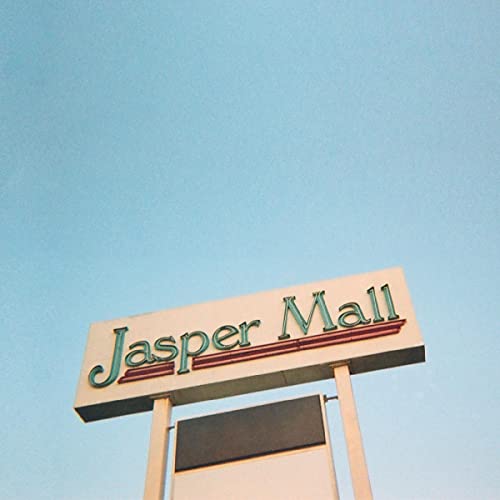 Jasper Mall" sign against a bright blue sky, low angle view.