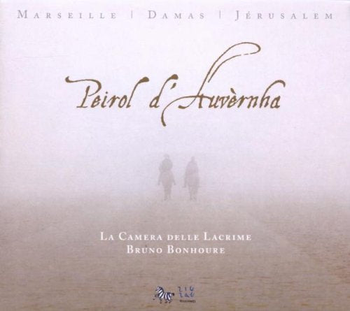 "CD cover with foggy landscape, two silhouetted figures, and gold cursive text."