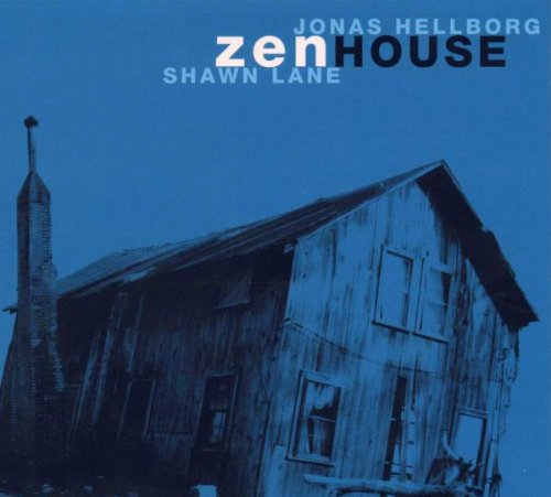 "Album cover featuring a blue-toned, dilapidated wooden house with a tall spire."