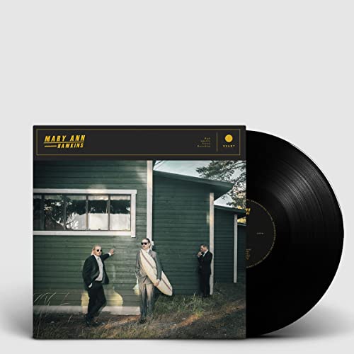 Vinyl record cover featuring a green house and three figures in suits.