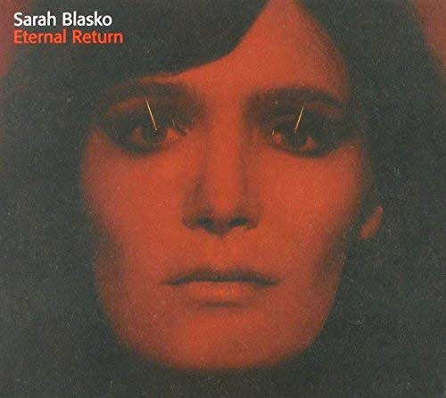 CD cover: close-up portrait of a woman with red tinting.