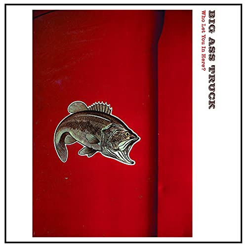 A fish sticker on a red metal surface with text on the right side.