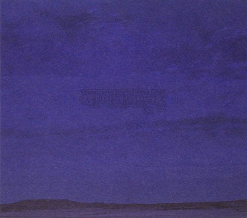 Blue album cover with the word "Titan" and a landscape silhouette.