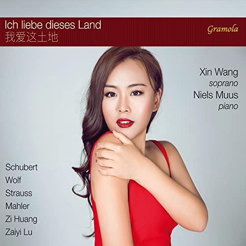 CD cover featuring soprano Xin Wang in a red dress, with text.