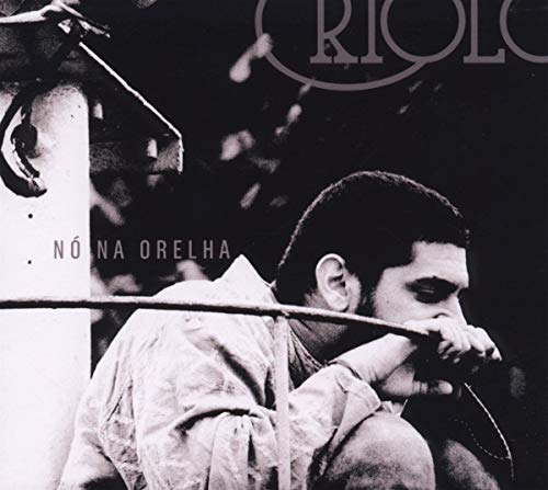Black and white CD cover featuring Criolo, a man with a mustache.