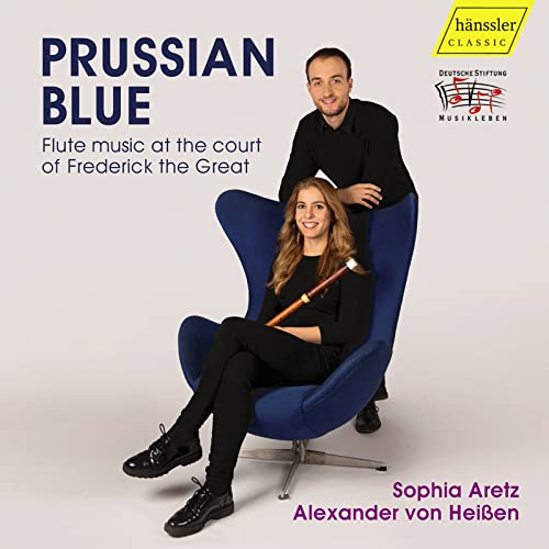 CD cover featuring two musicians, a woman with a flute, in blue chairs.