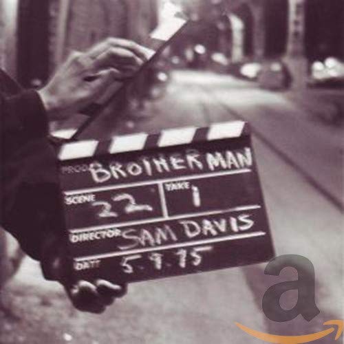 Black and white film clapperboard reading "Brotherman," scene 22, directed by Sam Davis.