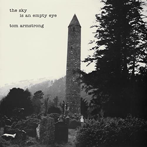 Black and white album cover featuring a tall, stone round tower.