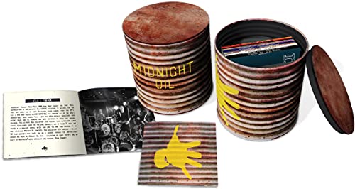Midnight Oil CD collection in a rusty, cylindrical metal container.