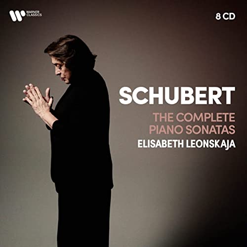Elisabeth Leonskaja standing in profile with hands together, with text overlay on brown background.