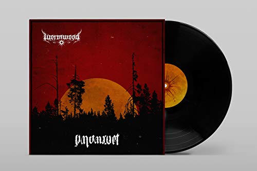 Vinyl record with red album cover featuring silhouetted trees and a full moon.
