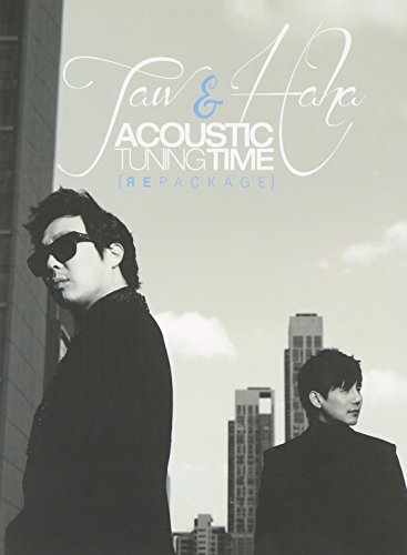 CD cover with two men in suits against a city skyline.