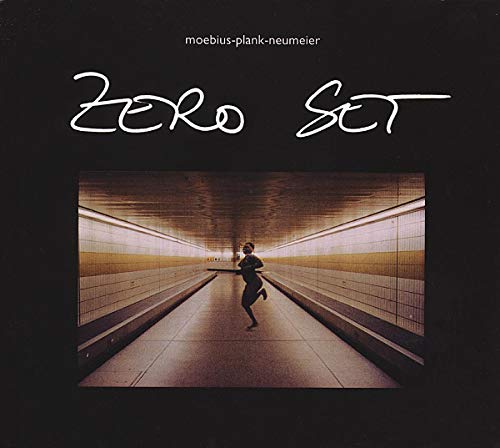 CD cover: a person running down a long, tiled subway tunnel.
