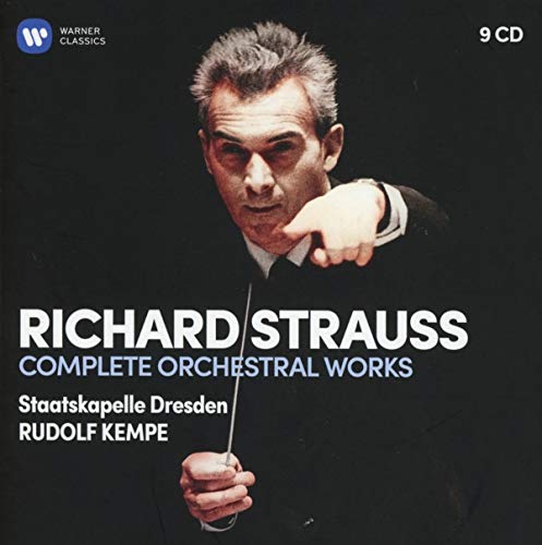 Conductor Rudolf Kempe in a tuxedo holding a baton against a black background.