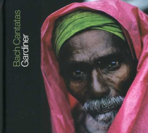 CD cover featuring a close-up of a man in a pink and green headwrap.