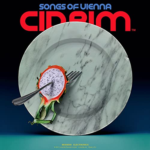 “Songs of Vienna” CD cover with dragon fruit on a marble plate.