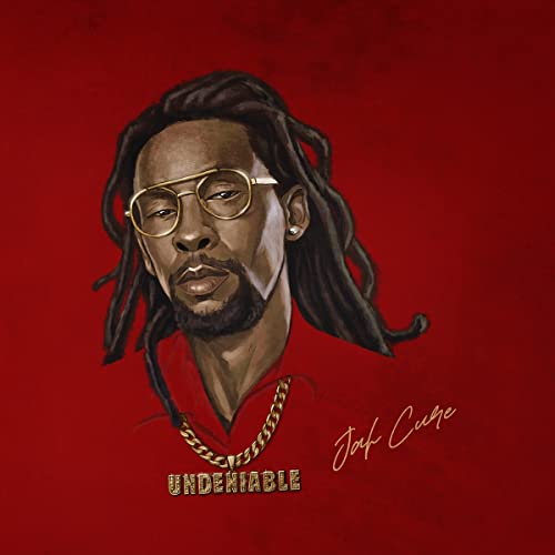 Portrait of Jah Cure with dreadlocks and sunglasses, album cover art.