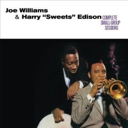 "Album cover featuring two men, one playing trumpet, against a black background."