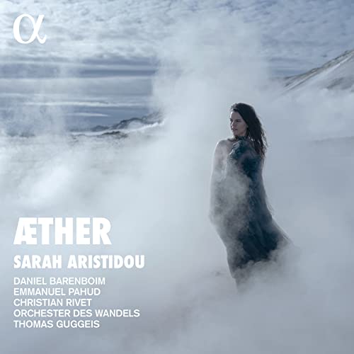 CD cover: woman in flowing dress amidst misty, mountainous landscape.